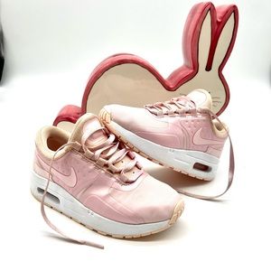 Light pink Nike tennis shoes girl